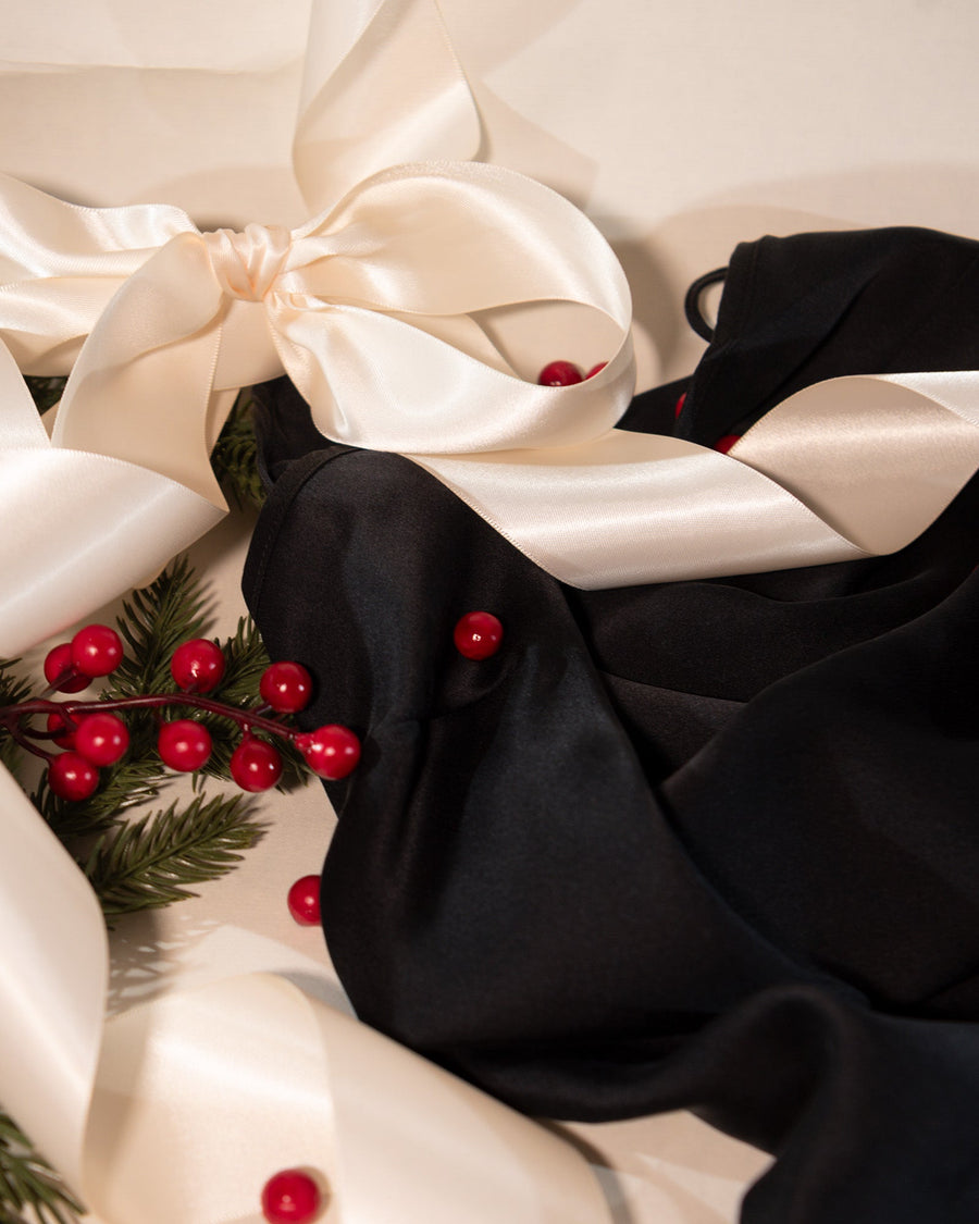 festive robes, ribbons and berries layered on eachother